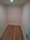Empty room with wood finished floors and recessed lighting
