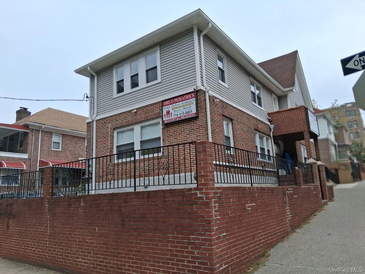 View of side of property featuring brick siding