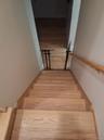 Staircase featuring wood finished floors