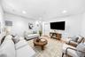 Living room featuring light wood-style floors and recessed lighting