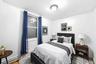 Bedroom featuring a baseboard radiator and baseboards