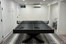 Rec room featuring an AC wall unit and recessed lighting