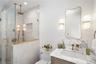 Full bath featuring vanity, a shower stall, and recessed lighting
