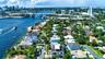 A breathtaking aerial perspective showcasing the neighborhood’s prime waterfront location along the Intracoastal, with the Fort Lauderdale skyline ris