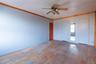 Spare room with ceiling fan, light hardwood / wood-style floors, and ornamental molding