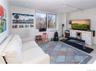 Living area featuring rail lighting