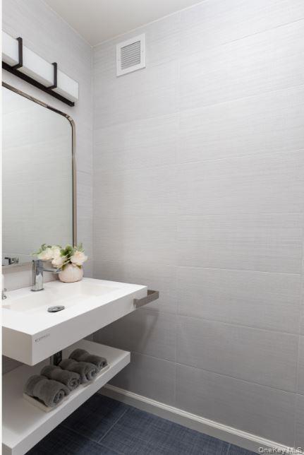 Bathroom with tile patterned flooring and visible vents