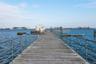 Dock area featuring a water view, with club house