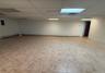 Empty room featuring a paneled ceiling and baseboard heating