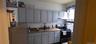 Kitchen with stainless steel appliances and white cabinetry