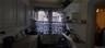 Kitchen with electric range and radiator