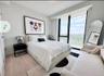 Bedroom with light wood-type flooring and baseboards