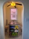 Detailed view of arched walkways and a ceiling fan