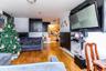 Living area featuring light wood-style floors and a baseboard heating unit