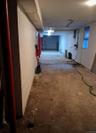 Unfinished below grade area featuring concrete block wall