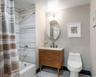 Full bath featuring shower / bathtub combination with curtain, vanity, and light tile patterned floors