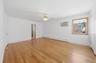 Newly painted with refinished original hardwood oak flooring, ceiling fan