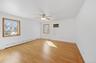 2nd bedroom, freshly painted, refinished original hardwood oak flooring, ceiling fan