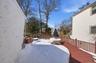 Expansive Trex deck with dining area and access to rear yard