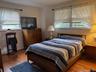 Bedroom with wood finished floors