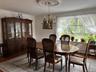 Dining area featuring wood finished floors and a chandelier