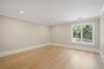 Empty room featuring light wood-type flooring, ornamental molding, and recessed lighting