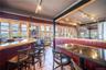 Indoor bar featuring track lighting and tile patterned flooring