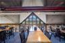 Dining area with carpet flooring and lofted ceiling