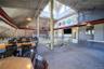 Dining space featuring high vaulted ceiling and carpet floors