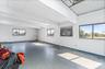 Unfurnished room with healthy amount of natural light, a skylight, and concrete floors