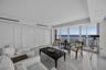 Living Room with Sliding Wall System To Den Closed