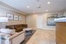 Living area with baseboards, visible vents, and recessed lighting