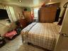 Bedroom with recessed lighting and light tile patterned floors