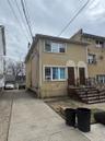 Townhome / multi-family property with stucco siding and cooling unit