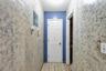 Hallway with wallpapered walls