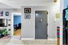 Entrance foyer with light marble finish floors and baseboards