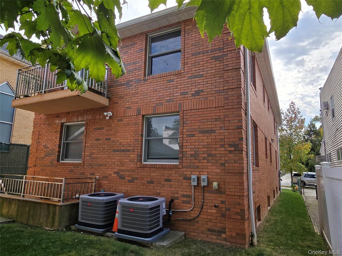 Rear view. two separate central air conditioners.
