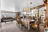 Dining area featuring carpet flooring and hanging lights