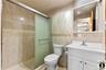 2nd Apartment Full bathroom with vanity, a stall shower, tile walls, and light tile patterned floors