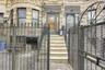 Property entrance with brick siding and fence