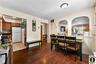 2nd Apartment Dining room featuring dark wood-style floors, arched walkways, and recessed lighting
