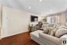2nd Apartment Living area with dark wood-type flooring and recessed lighting
