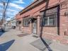 Property entrance with brick siding