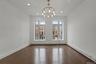 Unfurnished dining area featuring a baseboard heating unit, dark wood-style floors, a chandelier, and recessed lighting