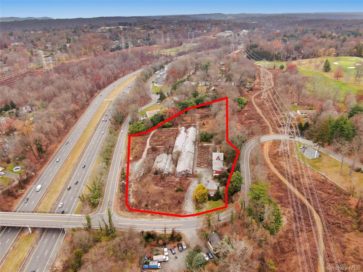View of property location featuring property boundaries highlighted and a major roadway