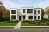 Contemporary house featuring stucco siding and a front yard