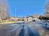 View of asphalt road with a residential view