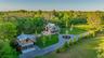 View from above of property featuring a wooded view