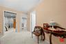 Hallway featuring carpet floors and crown molding