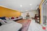 Living room featuring ornamental molding, recessed lighting, light marble finish floors, an AC wall unit, and a fireplace